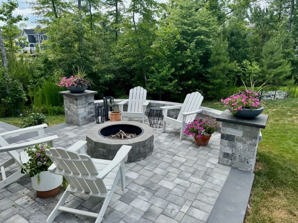 Circular paver fire pit patio with Adirondack chairs and seating