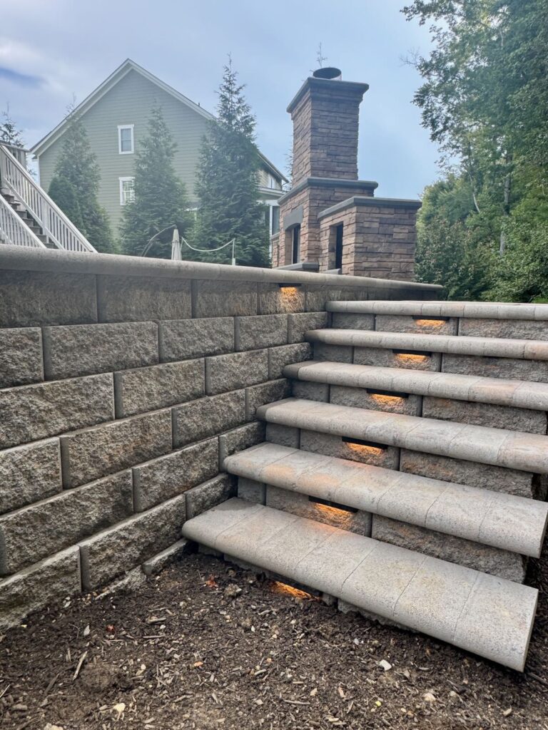 Stone steps with segmented retaining wall and landscaping