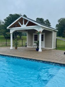 Poolside pavilion with white columns – Virginia backyard retreat