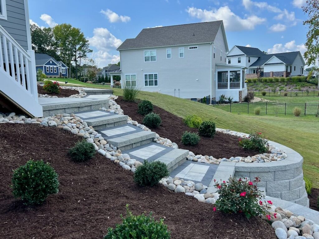 Retaining wall blocks with landscaping bed and mulch